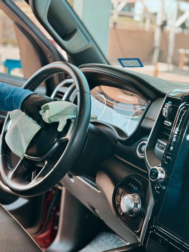 Brightworks Fort Worth interior detailing — cleaning the steering wheel of a RAM truck