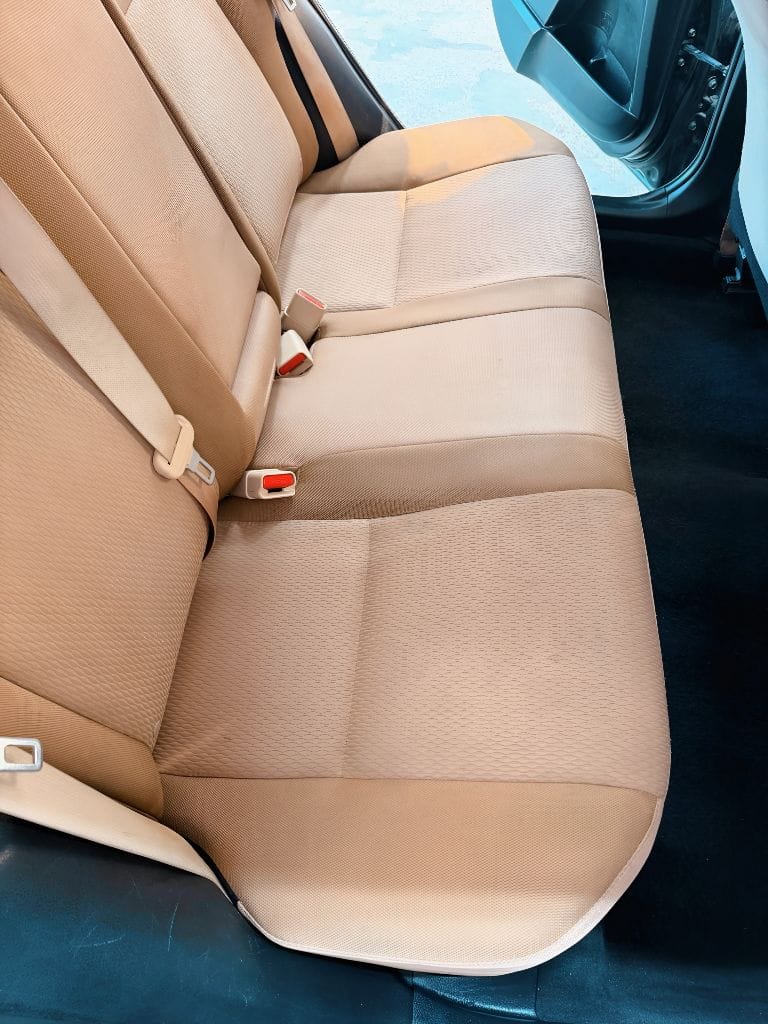 Immaculate tan rear bench seats after interior detailing service at Brightworks Fort Worth