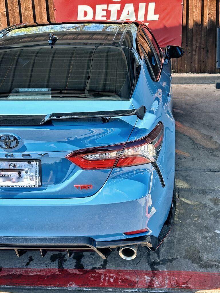 Blue Toyota Camry TRD rear end showing a flawless shine after detailing at Brightworks Granbury