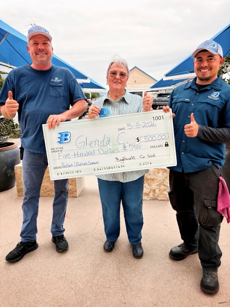 Brightworks Granbury Facebook giveaway winner Glenda C. receiving a $500 check — dated May 8, 2026